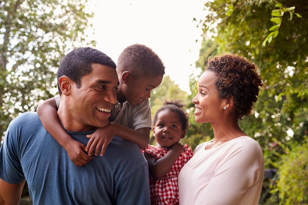 family of four smiling