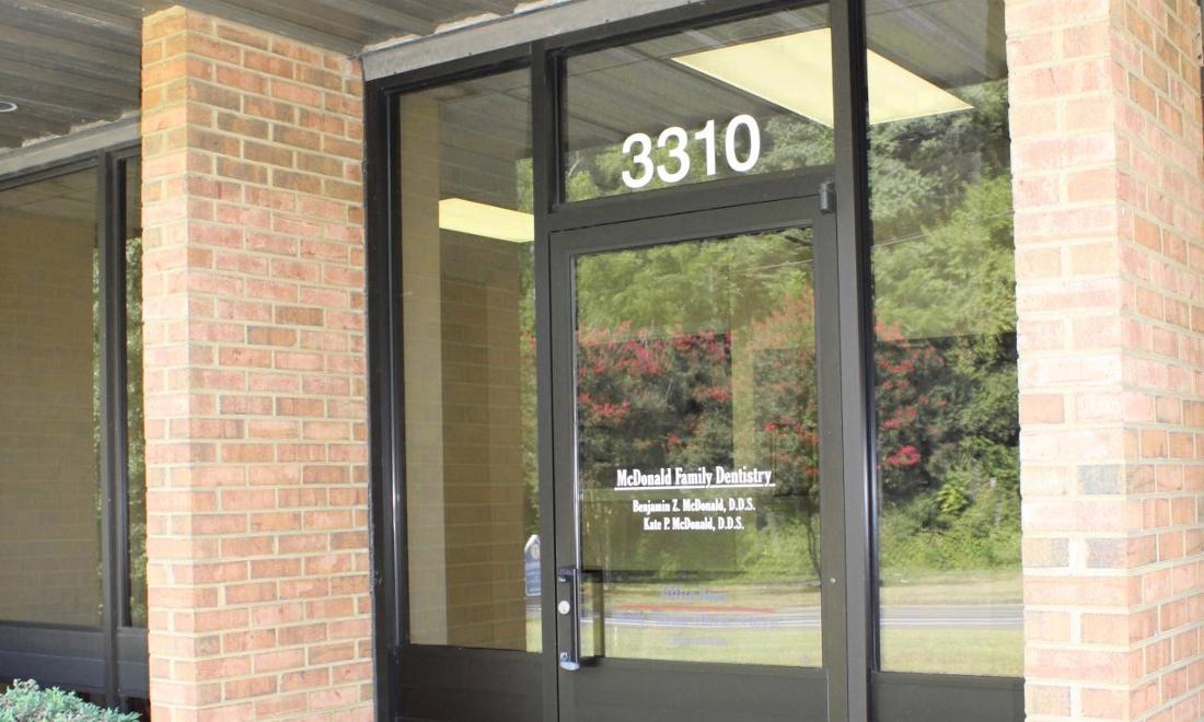 Glass front door of McDonald Family Dentistry 